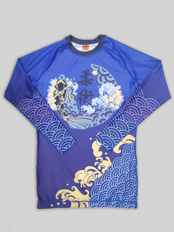 A cool bjj rash guard that features Asian aesthetic graphics. The blue jiu jitsu rash guard has purple, blue, and yellow graphic elements and a Koi design in the center. This is a rash guard for both men's and women's bjj.